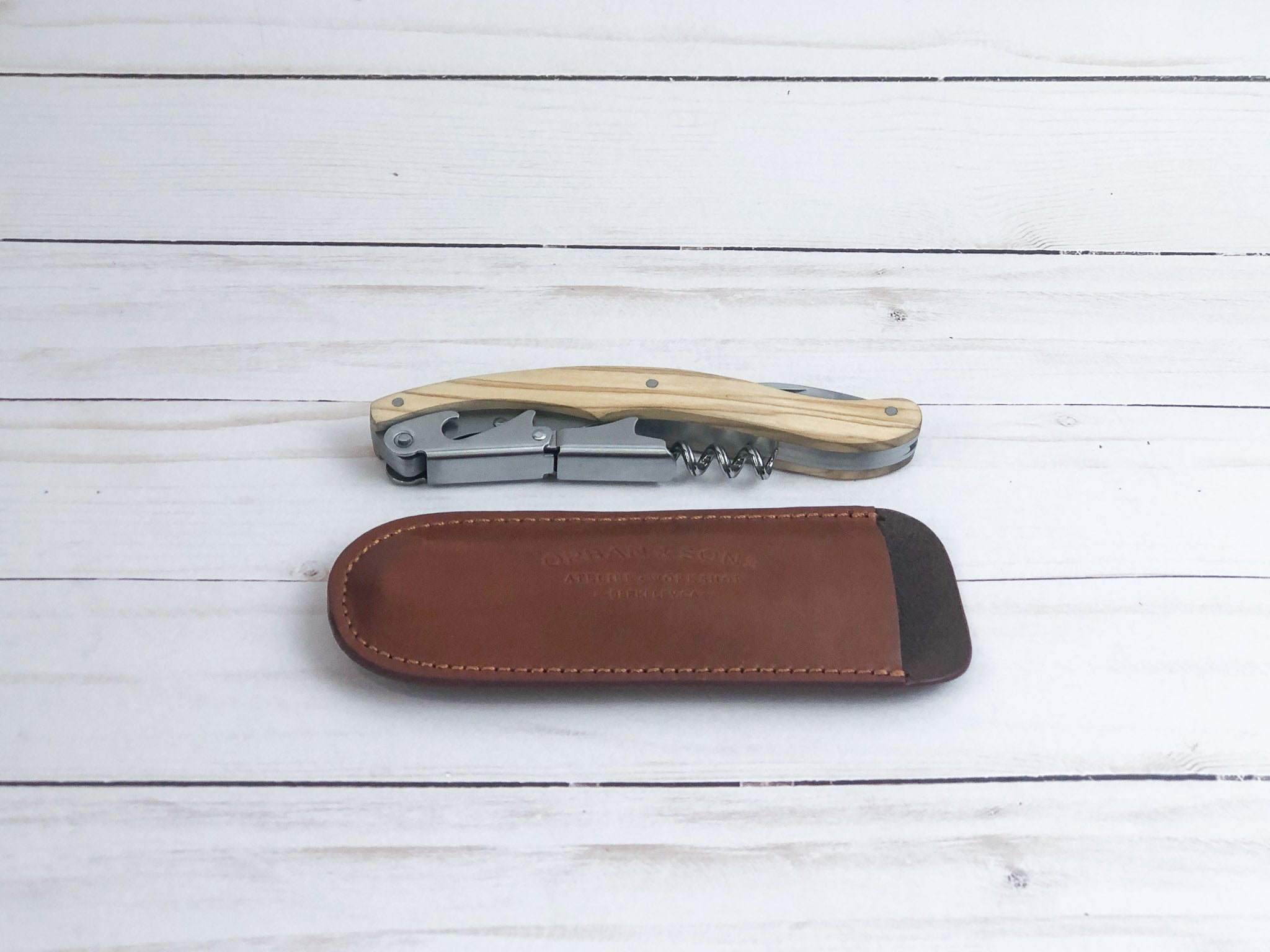 Olive wood corkscrew in a leather sheath